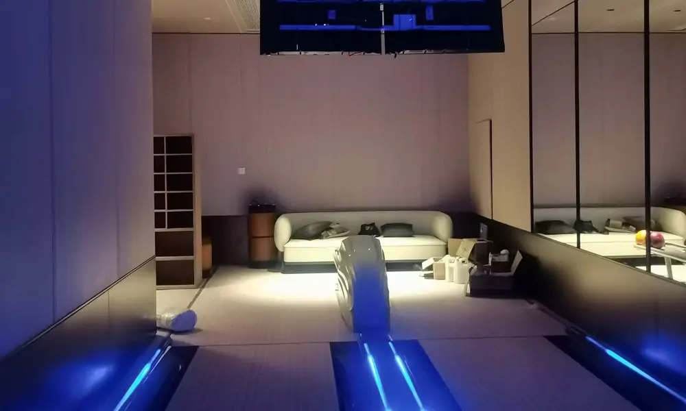 private residential bowling lane with a lounge area