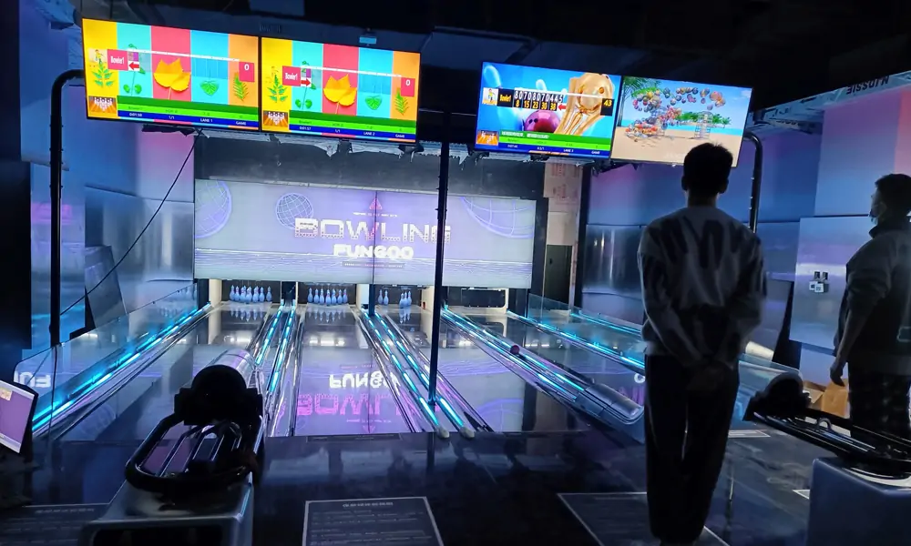 Interactive bowling alley with players watching