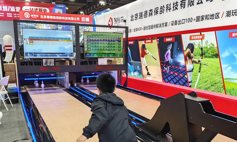 Children enjoying a game on the duckpin bowling equipment
